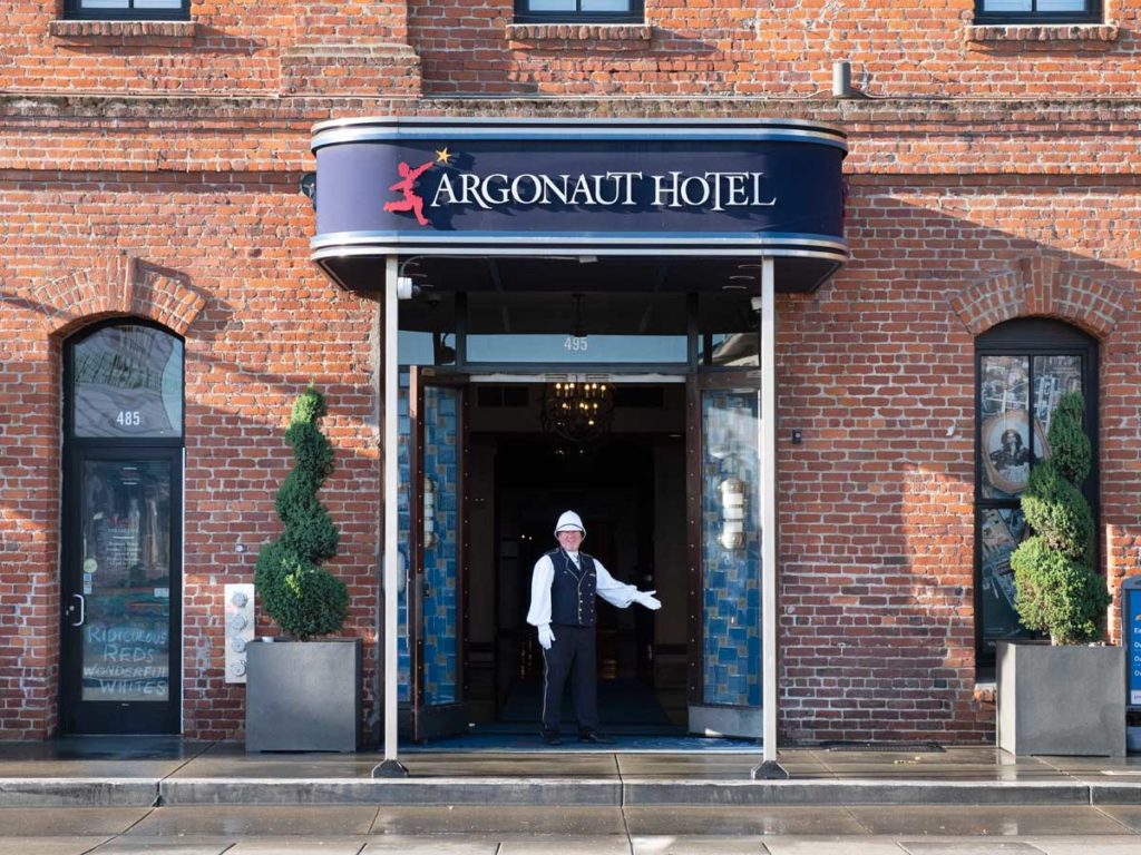 Bellman in front of Argonaut Hotel