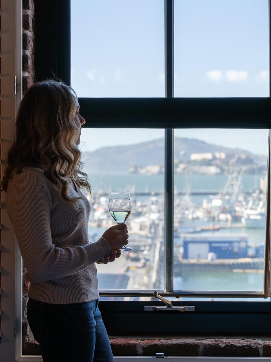 Girl With Wine Looking Out The Window