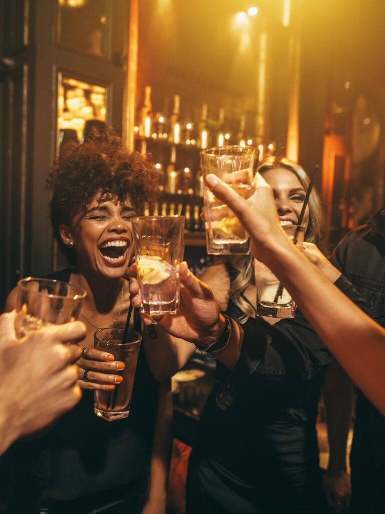 Friends Having Drinks At The Bar