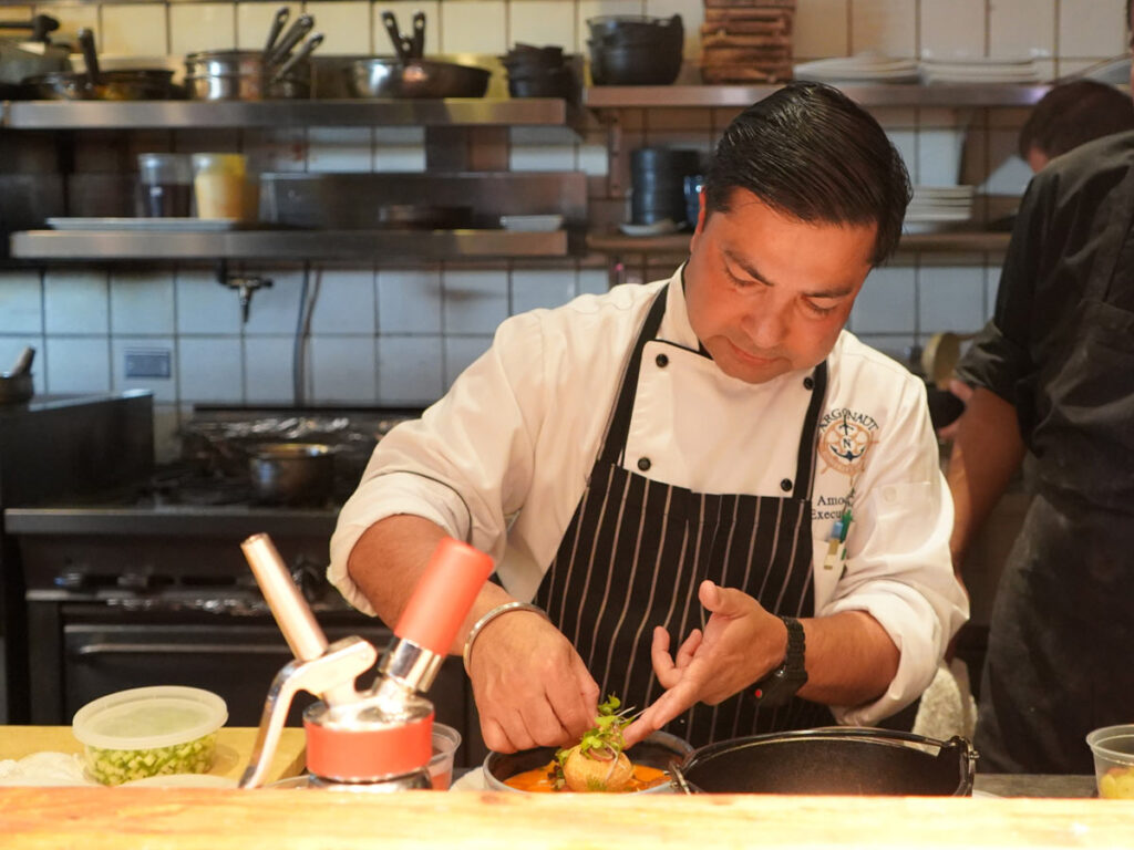 Chef Preparing A Dish In The Kitchen