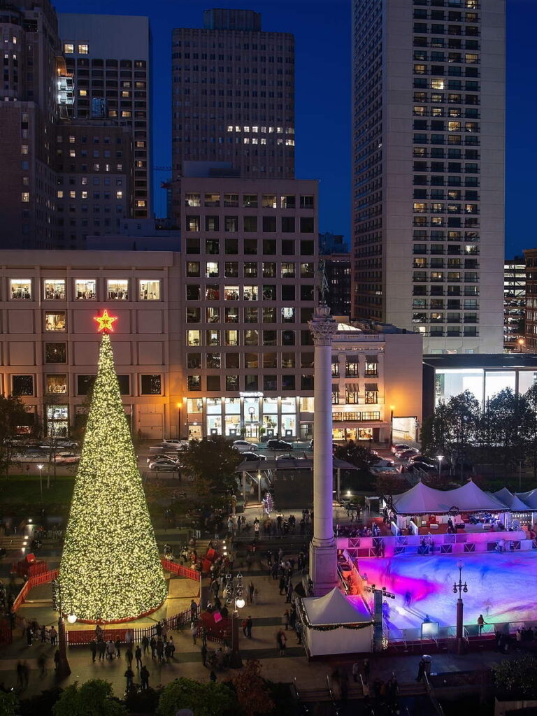Union Square Christmas tree and ice rink lit at dusk in downtown San Francisco, a short cable car ride from the Argonaut Hotel